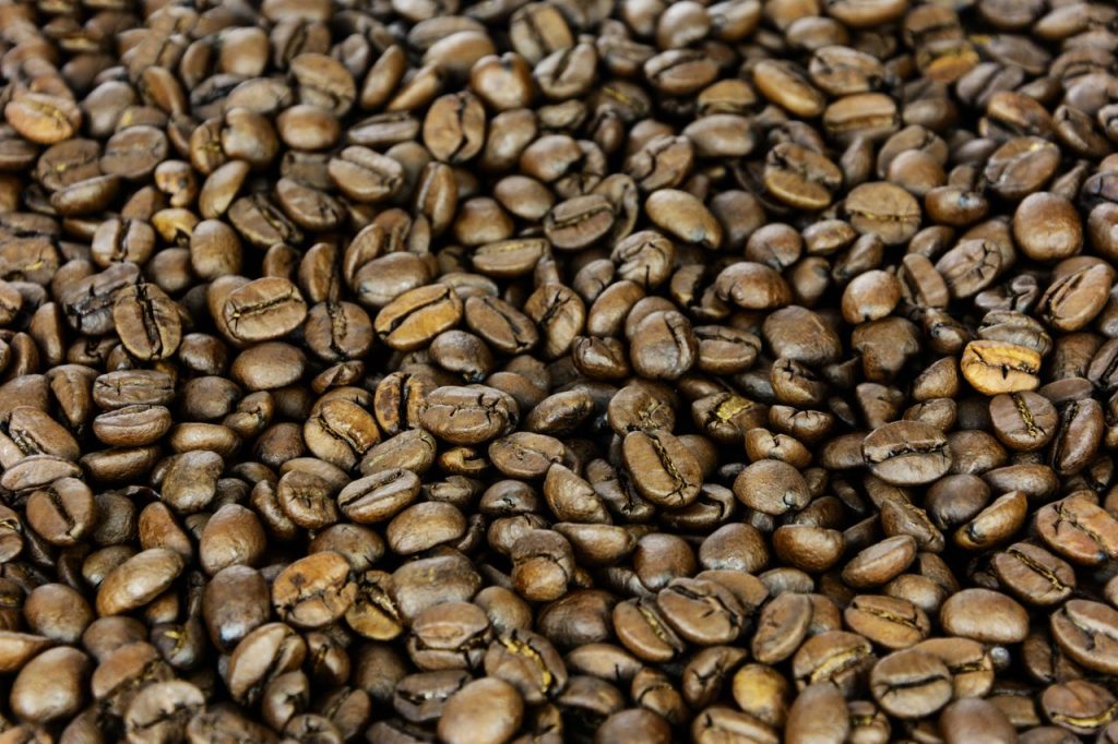 Detailed close-up of freshly roasted coffee beans, capturing texture and richness.